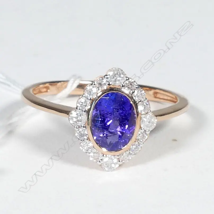 14ct Rose Gold Tanzanite and Diamond halo ring featuring centre Image 1++