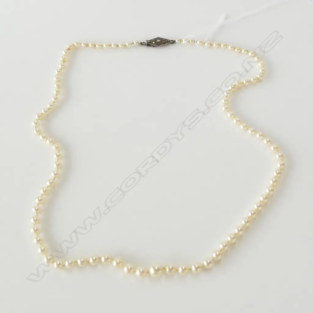 GRADUATED STRAND OF MIKIMOTO PEARLS Image 1++