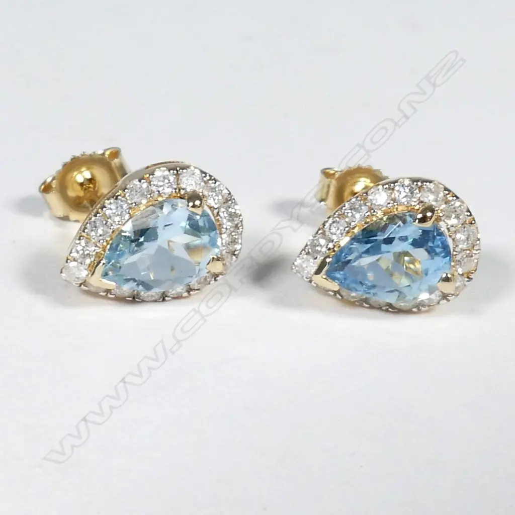 14ct Yellow Gold Aquamarine and Diamond stud earrings featuring centre Image 1++
