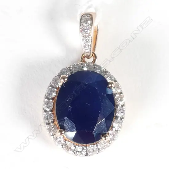 14ct Rose Gold Sapphire and Diamond halo pendant featuring centre