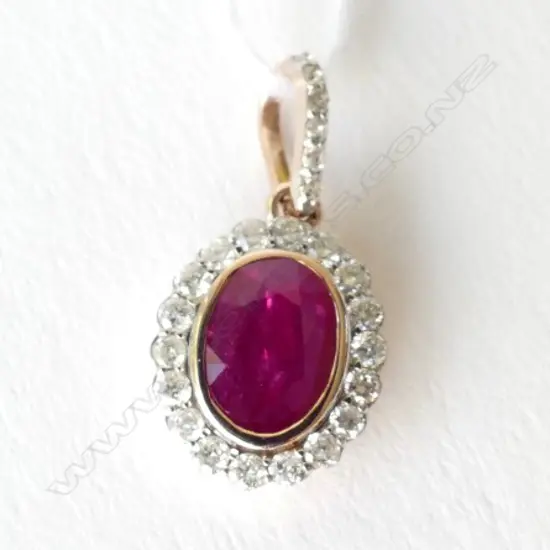 14ct Rose Gold Ruby and Diamond pendant featuring centre