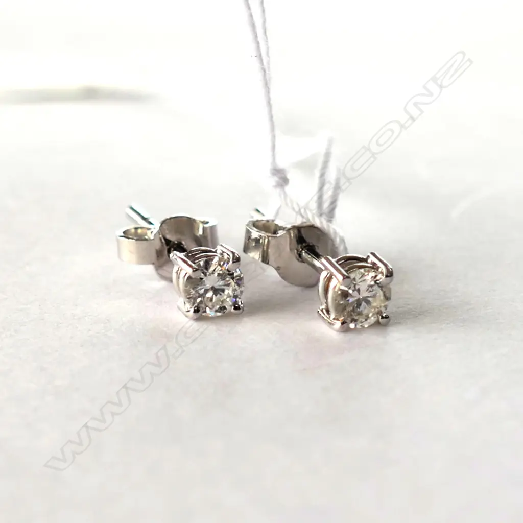 Each earring set with 0.18ct round brilliant cut diamond Image 1++