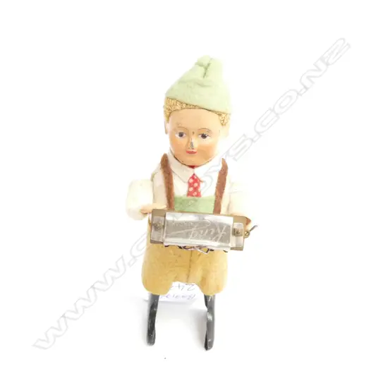 A SCHUCO C/WORK HARMONICA PLAYING BOY H 130 MM