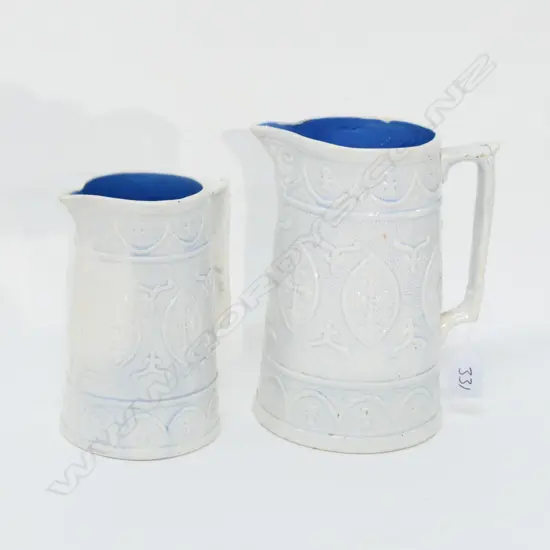 TWO RELIEF MOULDED JUGS