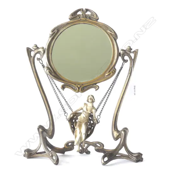 Art Nouveau 'Erte' silver plate dressing table mirror with young female in swing suspended from whiplash frame. Replacement chain. Stamped 'ERTE PARIS 1907'