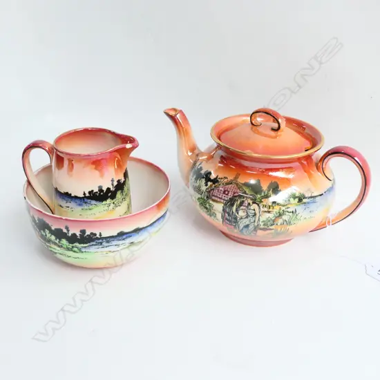 GRIMWADES 'MAORI WARE' LUSTRE TE HONGI TEAPOT, TE HONGI MILK JUG AF AND MAORI CARVER SUGAR BOWL