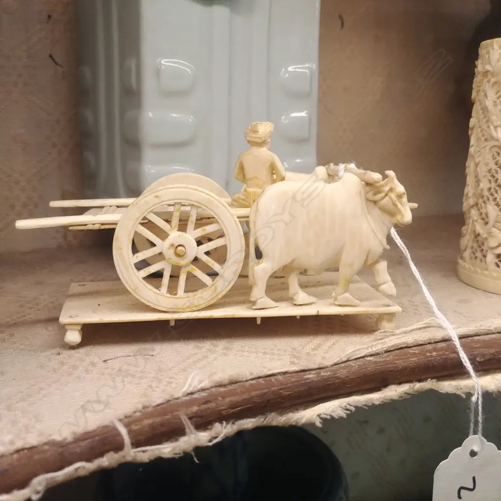 A chinese carved ivory figure group of two bullock and cart Image 1++