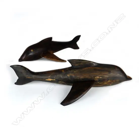 Two Pitcairn Island carved wood dolphins