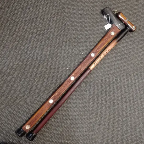 TWO MAORI SOUVENIR WALKING STICKS