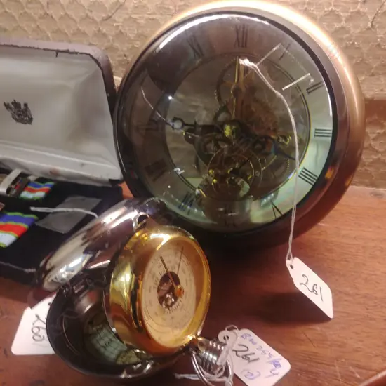 MAGNIFIED CLOCK AND POCKET BAROMETER