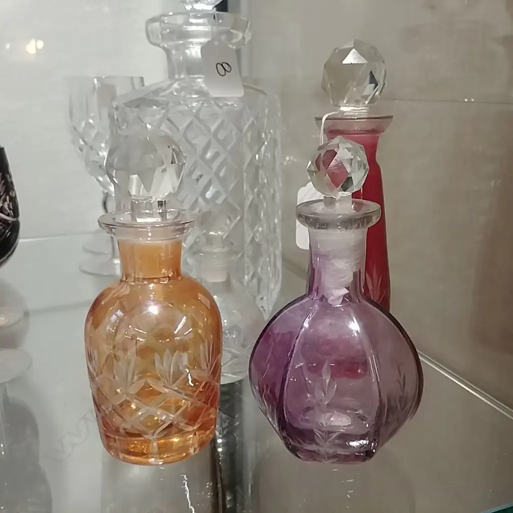 FOUR CUT GLASS COLOURED BOTTLES Image 1++