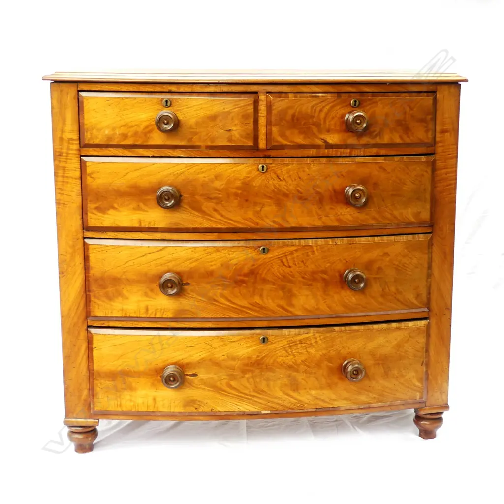 A Victorian mahogany bowfront five drawer chest Image 1++