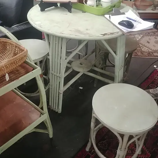 4 CANE STOOLS AND TABLE