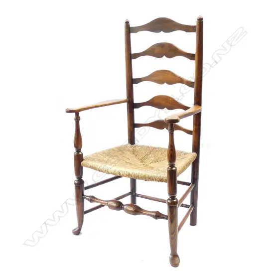 An oak country ladder back carver chair