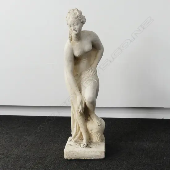 TALL CONCRETE GARDEN STATUE OF A SEMI CLAD WOMAN
