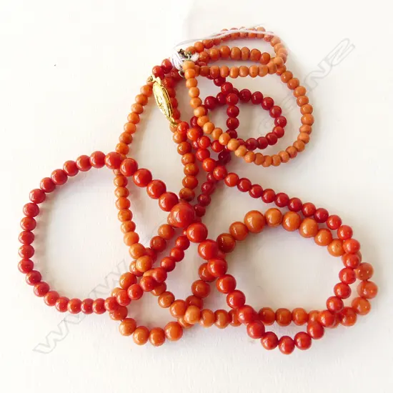 TWO CORAL BEAD NECKLACES