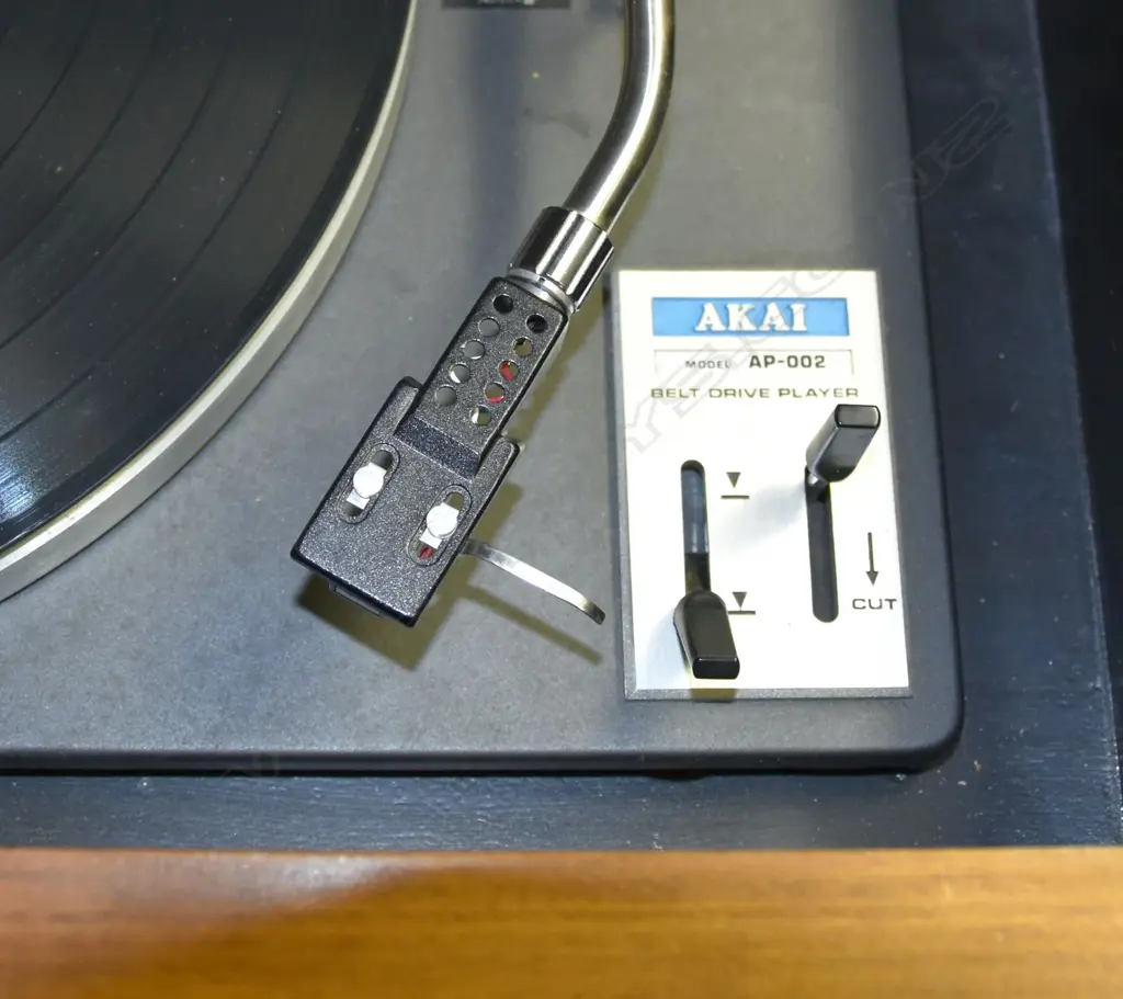 Model AP-002 Belt-drive turntable , by Akai, Turntable (only) in wood console. H.950mm Image 1++