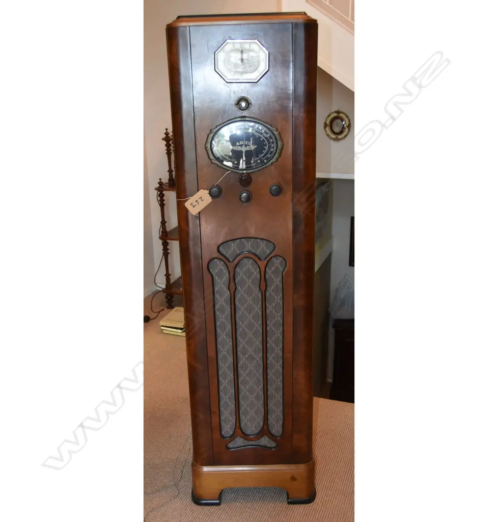 Model Radio-Clock, by Ariel, Wood console. H.1585mm Image 1++