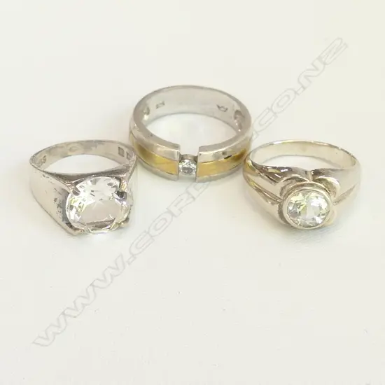 THREE STERLING SILVER RINGS SET WITH CZs