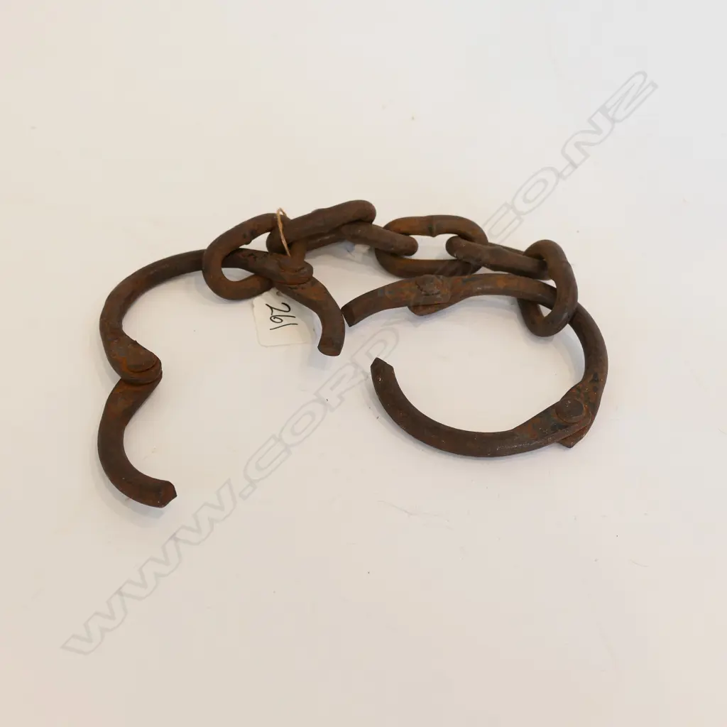 A pair of wrought iron manacles; without locking mechanism Image 1++