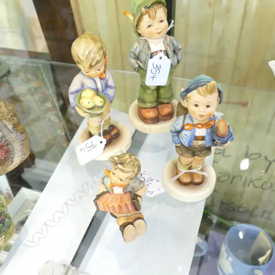 4 HUMMEL FIGURINES