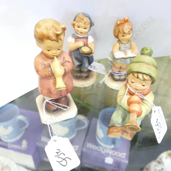 4 BOXED HUMMEL FIGURINES