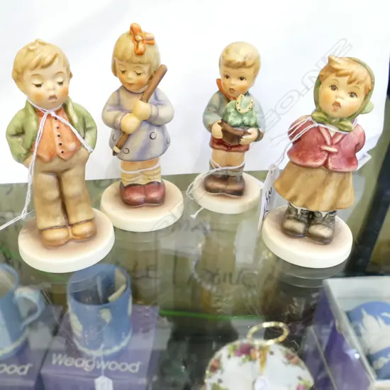 4 BOXED HUMMEL FIGURINES
