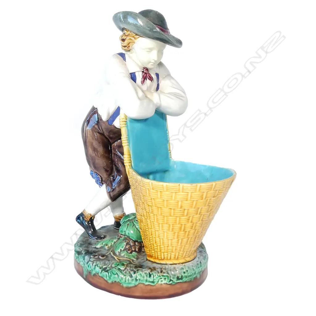 A Victorian Minton majolica young grape picker with basket Image 1++