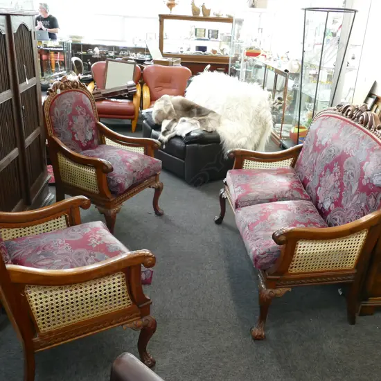 3 PC CARVED LOUNGE SUITE - 2 SEATER + 2 CHAIRS IN RED FLORAL WITH CANE SIDES