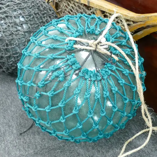 LARGE GLASS FISHING FLOAT WITH NETTING...