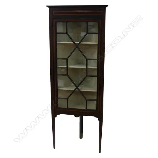 A small Edwardian Sheraton revival standing corner cabinet