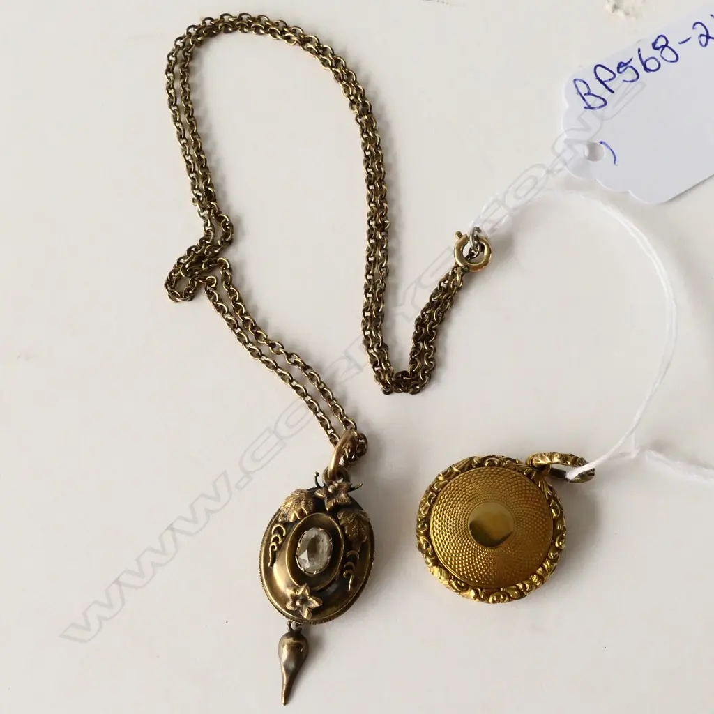 TWO ANTIQUE PINCHBECK MOURNING PENDANTS Image 1++