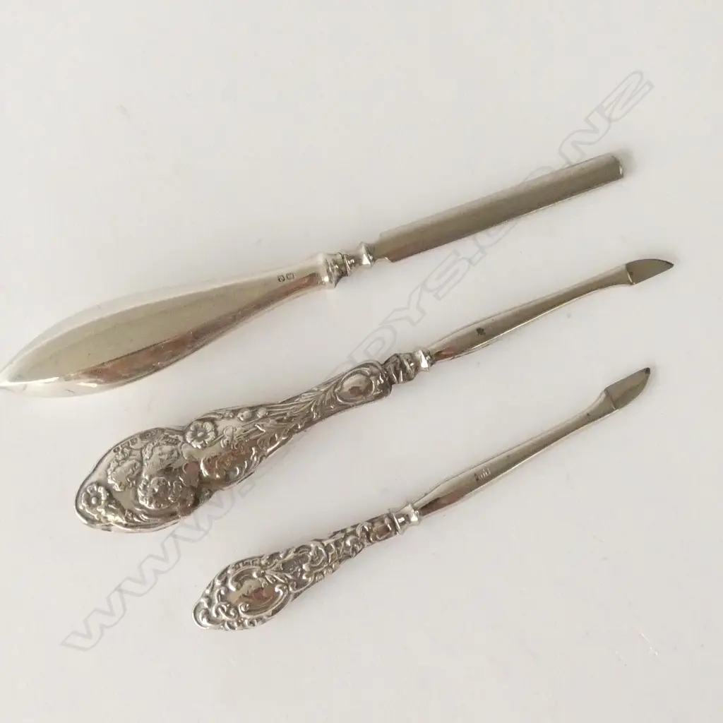 THREE SILVER HANDLED MANICURE PIECES Image 1++