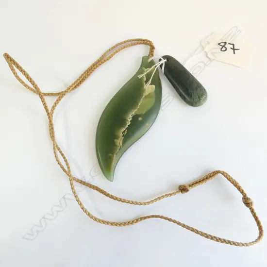 TWO GREENSTONE POUNAMU PENDANTS.LONGEST 85MM.