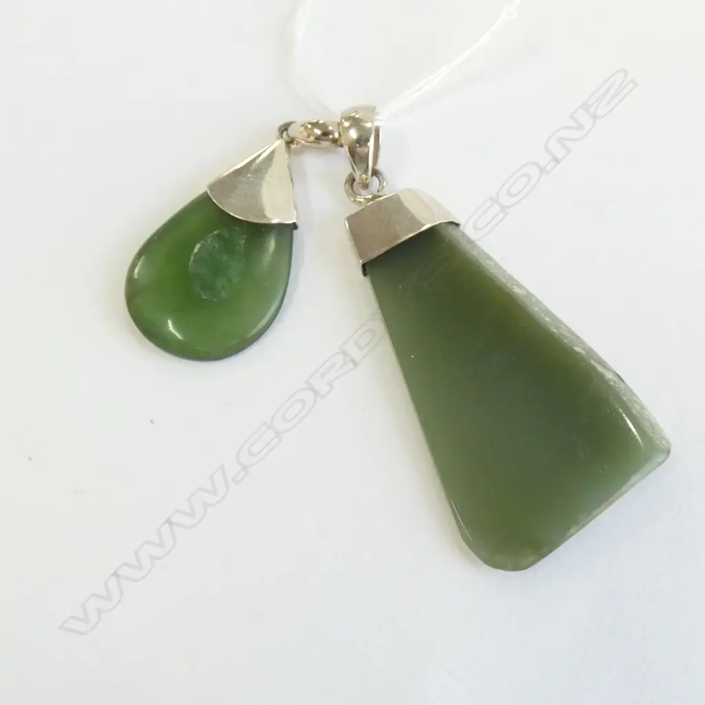 TWO POUNAMU GREENSTONE PENDANTS.STERLING SILVER CAP. Image 1++
