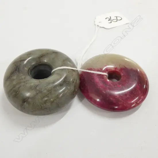2 JADE DISC PENDANTS. 1 RED/WHITE 1 MOTTLED GREEN