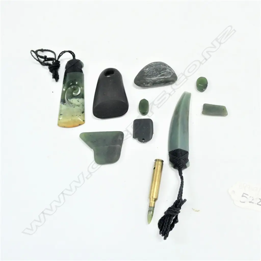 BAG OF GREENSTONE AND A BLACK STONE ADZE WITH LARGE HOLE Image 1++