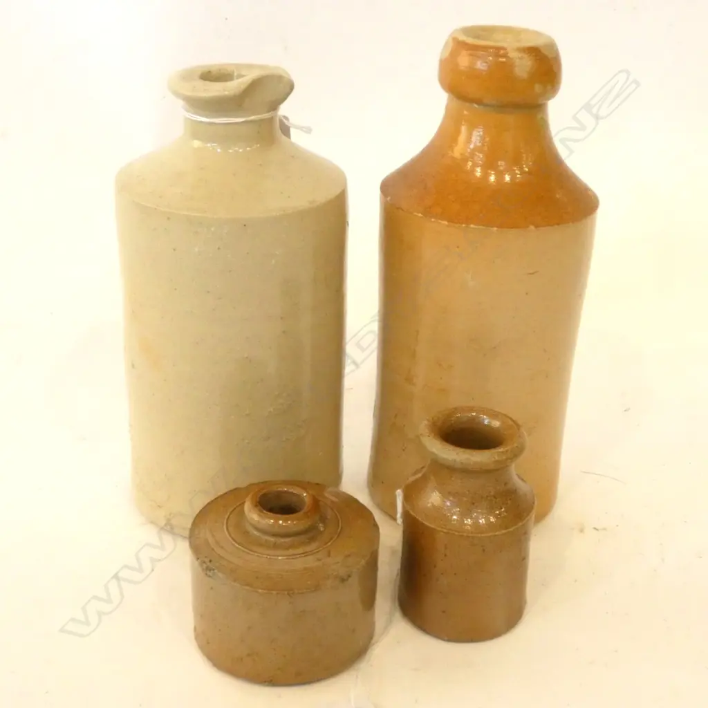 FOUR STONEWARE BOTTLES (CHIPS) Image 1++