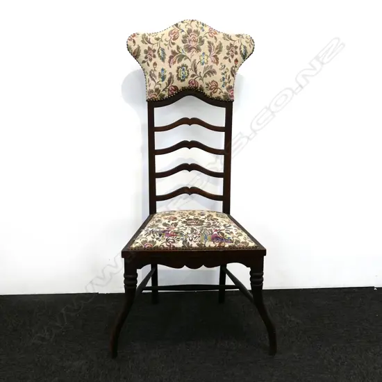 An Edwardian mahogany ladder-back hall chair