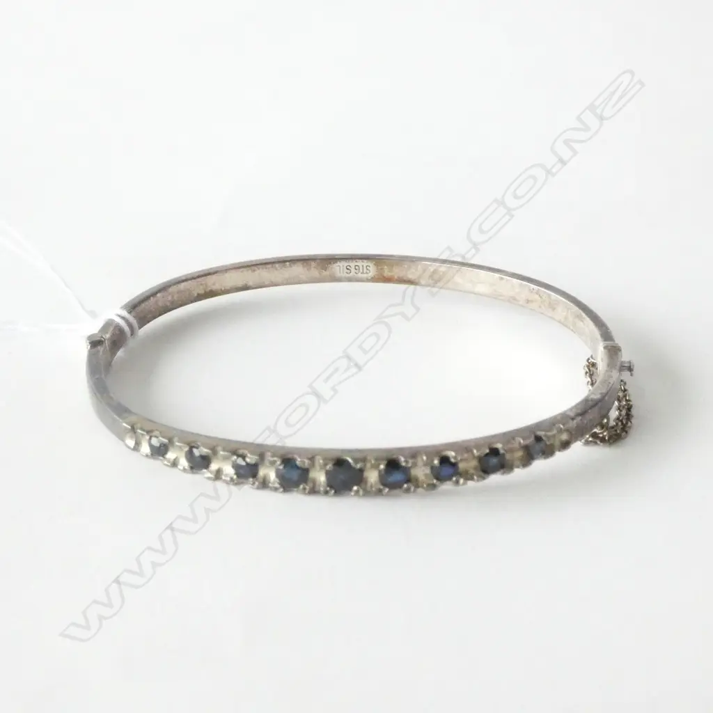 STERLING SILVER AND SAPPHIRE HINGED BANGLE Image 1++