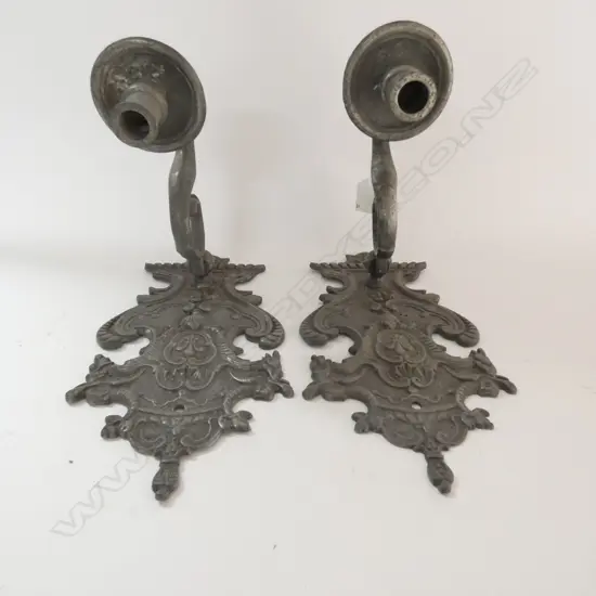 A pair of 19thC highly decorative candle sconces