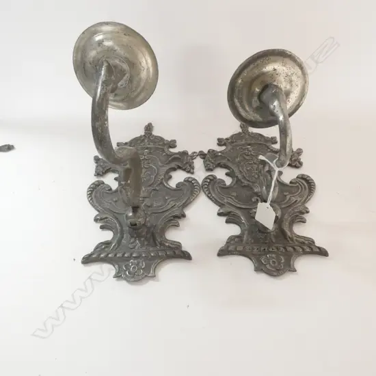 A pair of 19thC highly decorative candle sconces