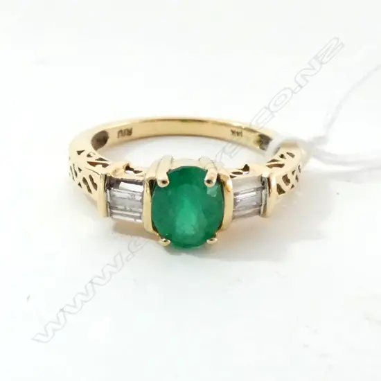 14CT GOLD DIAMOND AND EMERALDS RING (ONE BAGUETTE DIAMOND ABSENT)