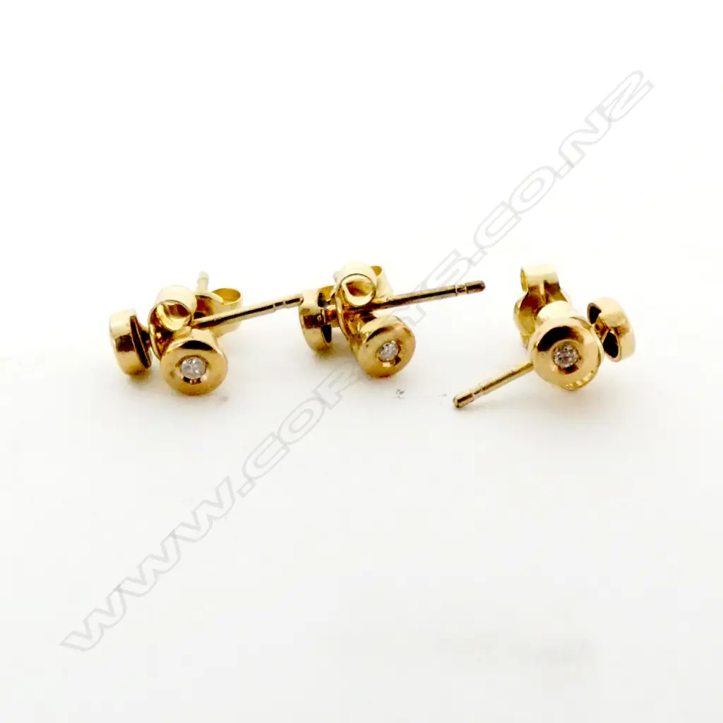 THREE PAIRS OF 9CT GOLD AND DIAMOND STUD EARRINGS Image 1++