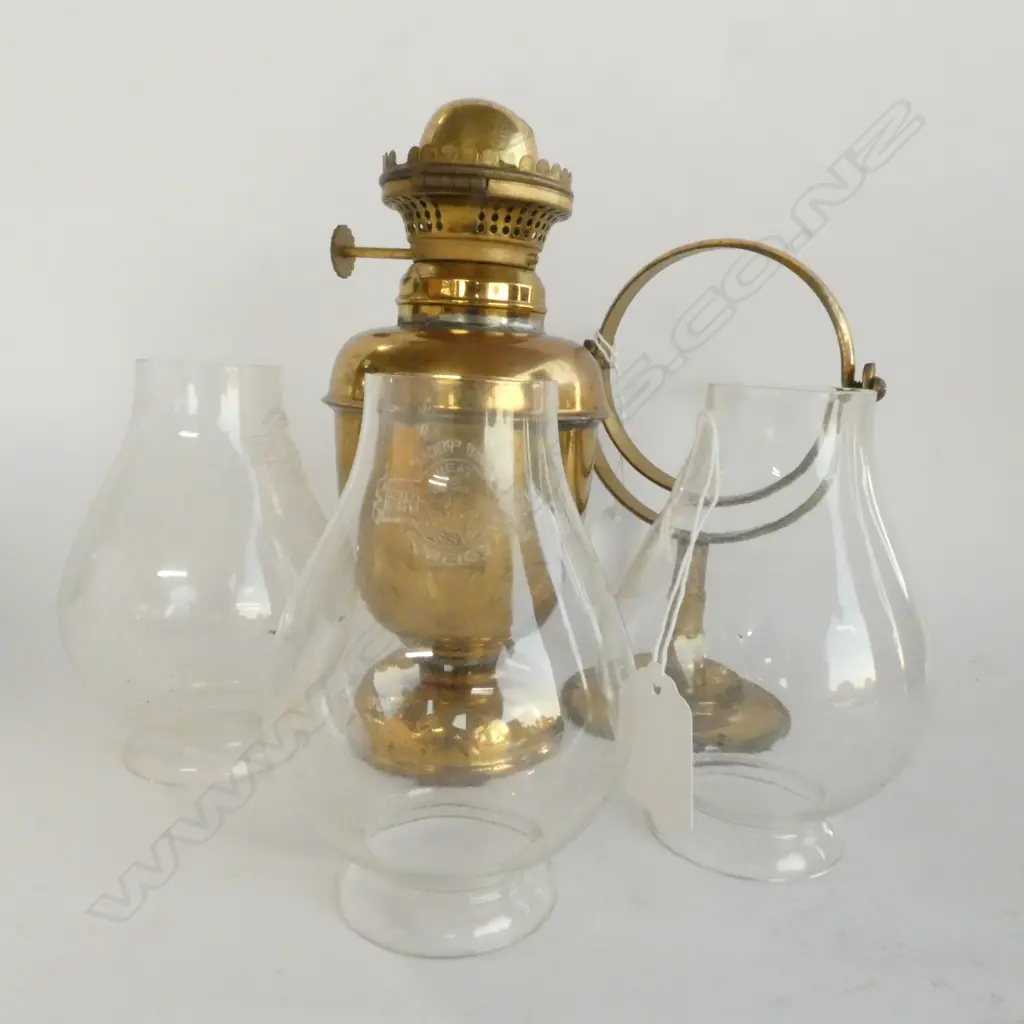 A BRASS GIMBALED LAMP WITH 3 GLASS CHIMNEYS H 320 MM Image 1++