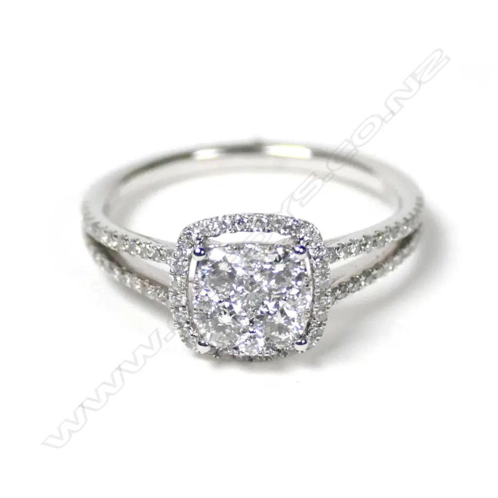 An 18ct white gold diamond cluster ring Image 1++