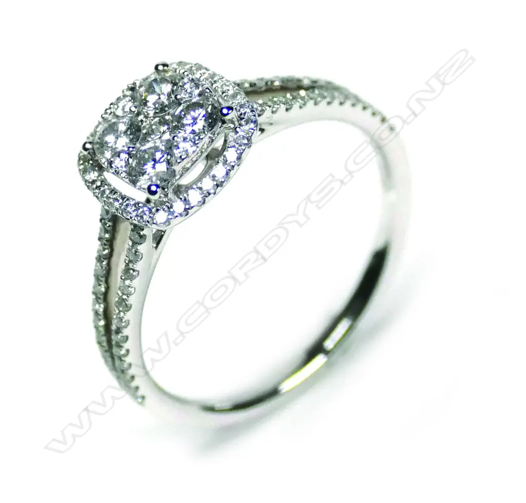 An 18ct white gold diamond cluster ring Image 1++