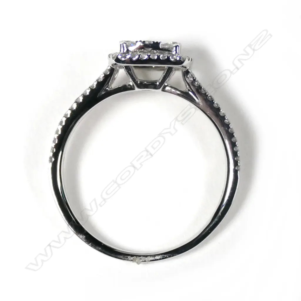 An 18ct white gold diamond cluster ring Image 1++