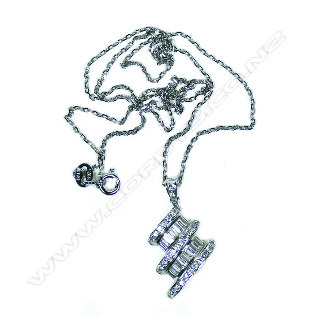 An 18ct white gold and diamond pendant Image 1++