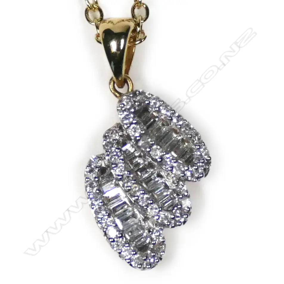 An 18ct white gold and diamond pendant Image 1++
